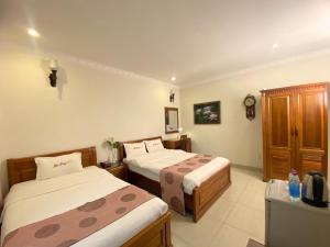 Letto o letti in una camera di Dai Long Hotel