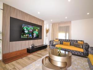 TV a/nebo společenská místnost v ubytování Holiday Home La Superbe by Interhome