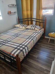 Un ou plusieurs lits dans un hébergement de l'établissement Cypress Suites