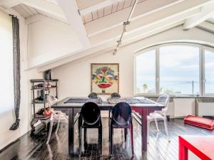 a dining room with a table and chairs at Apartment Verney by Interhome in Albisola Superiore