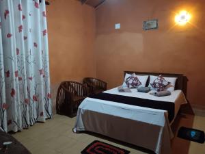 a bedroom with a bed in a room at කැලෑව Jungle Eco Resort in Anuradhapura