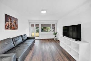 TV a/nebo společenská místnost v ubytování PEARL09 Appartement spacieux près de Bienne 2D