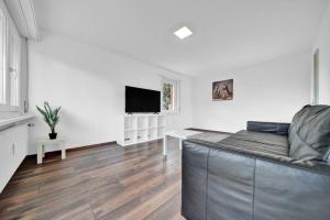 TV a/nebo společenská místnost v ubytování PEARL09 Appartement spacieux près de Bienne 2D