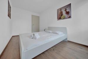 Postel nebo postele na pokoji v ubytování PEARL09 Appartement spacieux près de Bienne 2D