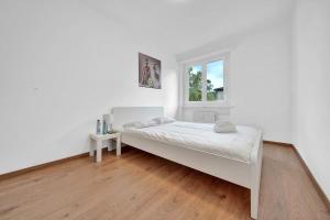 Postel nebo postele na pokoji v ubytování PEARL09 Appartement spacieux près de Bienne 2D