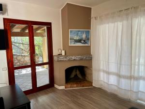 TV a/nebo společenská místnost v ubytování Villa Marinella By La Via Del Mare Viaggi e Vacanze + 35 fotografií