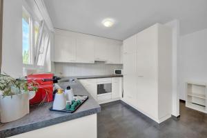 Kuchyň nebo kuchyňský kout v ubytování PEARL07 Appartement lumineux 2G