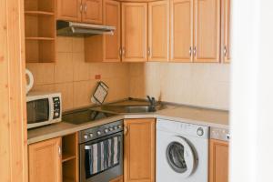 Kuchyň nebo kuchyňský kout v ubytování Apartamenty Optimal