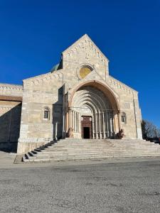 a church with stairs in front of a building at VVR6 Apartment by Homes in Ancona in Ancona
