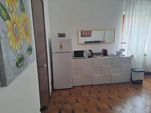 Kuchyň nebo kuchyňský kout v ubytování Room GRIGRA