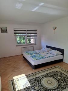 Postel nebo postele na pokoji v ubytování Apartman Mickey