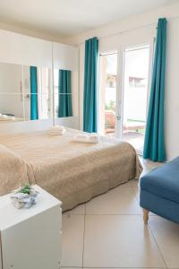 Posteľ alebo postele v izbe v ubytovaní Residenza del Barone Luxury House - Pula, Sardegna + 37 fotografií
