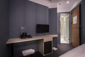 TV a/nebo společenská místnost v ubytování Yi Su Hotel-Taipei Ningxia