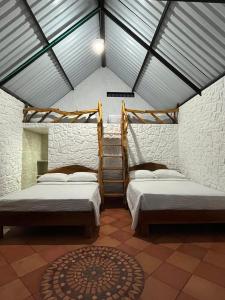 Ένα ή περισσότερα κρεβάτια σε δωμάτιο στο Cabañas Villa del Prado