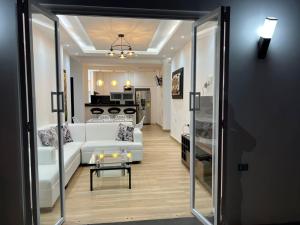 a living room with a white couch and a table at Casa Blanca in Playas +15 photos