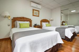 Cama ou camas em um quarto em Hotel El Marqués
