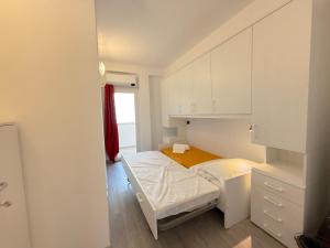 Postel nebo postele na pokoji v ubytování Gatto Marino Apartment