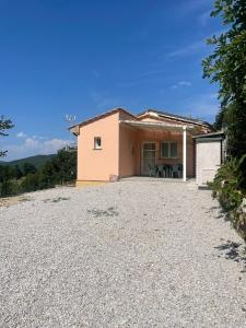 a house on top of a gravel driveway at Casa Belvedere in Sasso Pisano