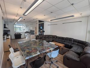 a living room with a couch and a table at Duel of Bristol House 6BR 12 beds in Bristol