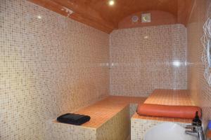 a bathroom with a tub with a sink and a shower at Gites d'Arles Bungalow T1 BIS in Le Moule