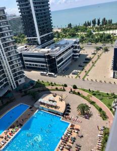 an aerial view of a resort with a swimming pool at Luxury Suites White Sails in Batumi