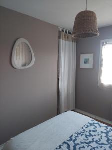 Postel nebo postele na pokoji v ubytování Chambres d'Hotes des Ecureuils