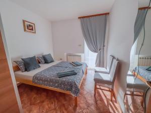 Postelja oz. postelje v sobi nastanitve Apartman 1