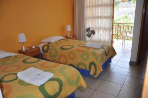 Postel nebo postele na pokoji v ubytování Hotel Bracamonte