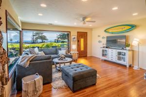 a living room with a couch and a table at Bluewater Retreat by Paradise Retreats in Santa Barbara