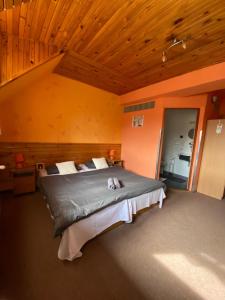A bed or beds in a room at Penzión Skitour