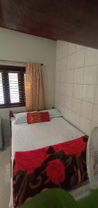 Postel nebo postele na pokoji v ubytování Nakshatra Homestay