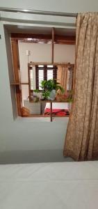 Postel nebo postele na pokoji v ubytování Nakshatra Homestay