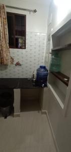 Kuchyň nebo kuchyňský kout v ubytování Nakshatra Homestay