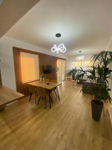 a living room with a table and a couch at Hira apartment in Golem