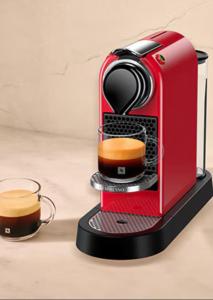 a red coffee maker with a cup of coffee at La perle de Sète Maison bord de l étang Animaux bienvenus Sur demande in Sète