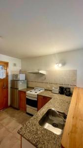 Kuchyň nebo kuchyňský kout v ubytování Apart Hotel del Pellin