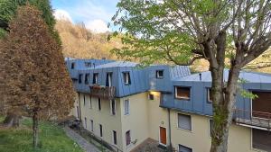 a row of buildings with blue roofs at Alfaro54 in Brunate