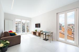 a living room with a couch and a table at Borgo Trento Residence in Verona