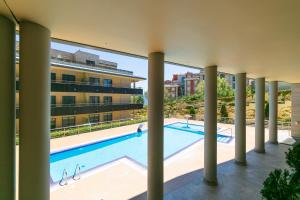 an image of a swimming pool in a building at Playa Sanxenxo in Sanxenxo