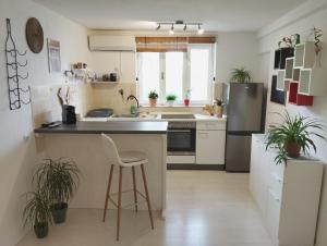 a kitchen with a sink and a stove top oven at Apartment Lozica with private garden, self check-in in Korčula +4 photos