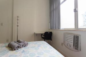 Giường trong phòng chung tại SUH Copacabana 36 Confort Sun