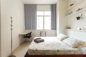 Giường trong phòng chung tại SUH Copacabana 36 Confort Sun