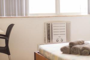 Giường trong phòng chung tại SUH Copacabana 36 Confort Sun