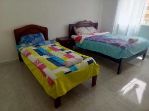 Postel nebo postele na pokoji v ubytování Hotel CasaBlanca"Tablon de miraflores"