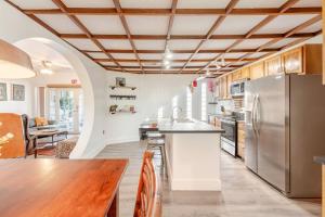 a kitchen with a table and a refrigerator at 10 Minutes from Beach Full House in Hollywood