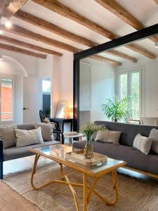 a living room with a couch and a coffee table at Cal Moline 1 in Aviá