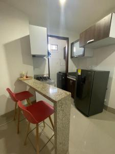 Kuchyň nebo kuchyňský kout v ubytování Excelente apartaestudio