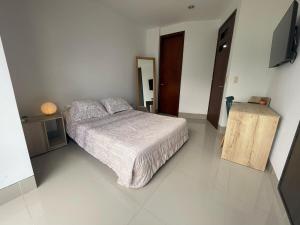 Postel nebo postele na pokoji v ubytování Excelente apartaestudio