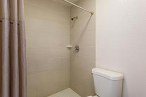 a bathroom with a toilet and a shower at Motel 6-Macclenny, FL in Macclenny +19 photos