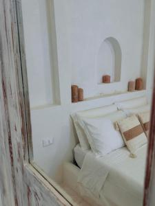 Letto o letti in una camera di Dimore i Messapi Suites Diffuse